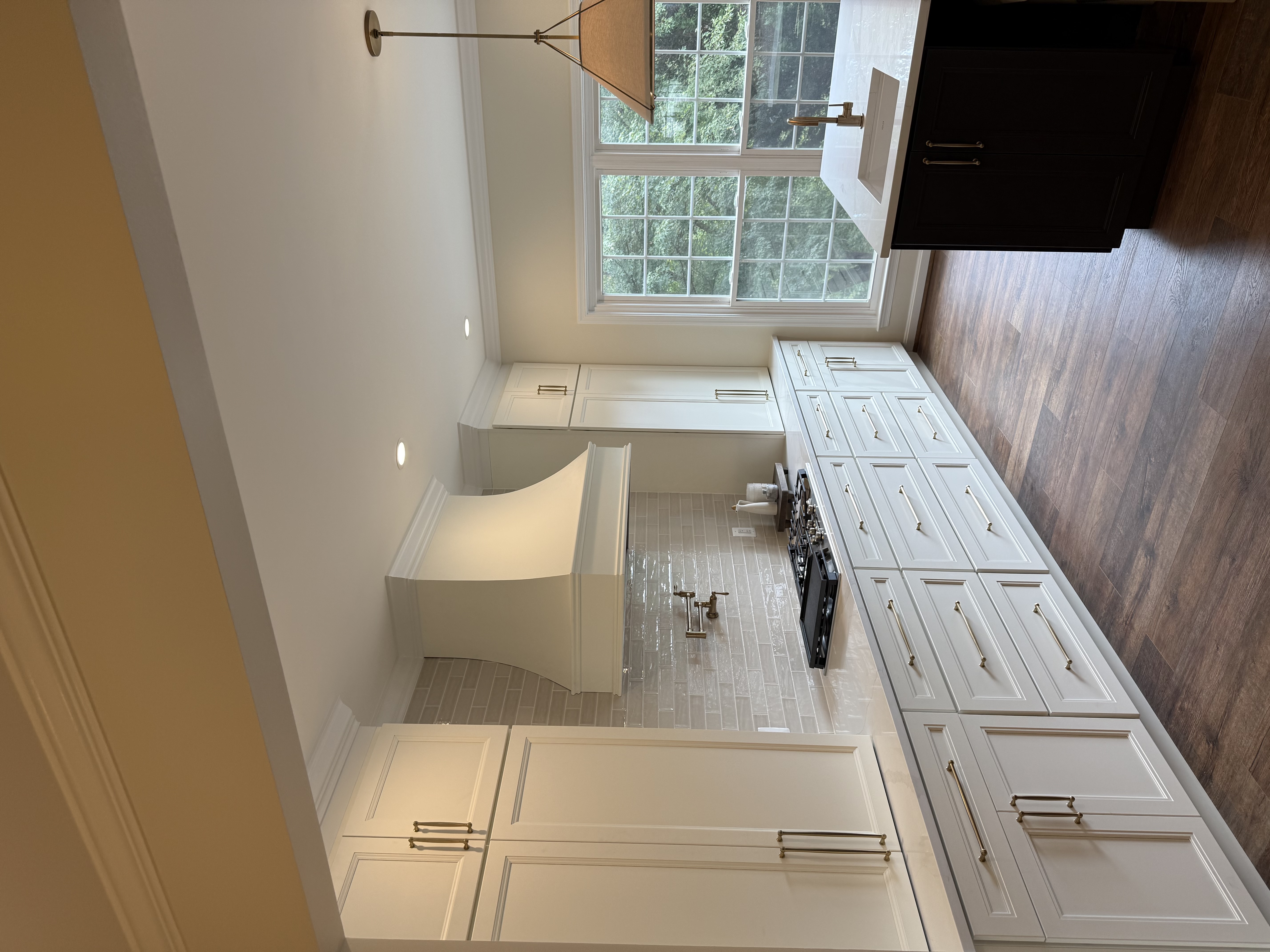 Kitchen remodel — white cabinetry detail with quartz countertops