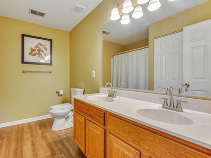 Bathroom before home prep — dated vanity and fixtures
